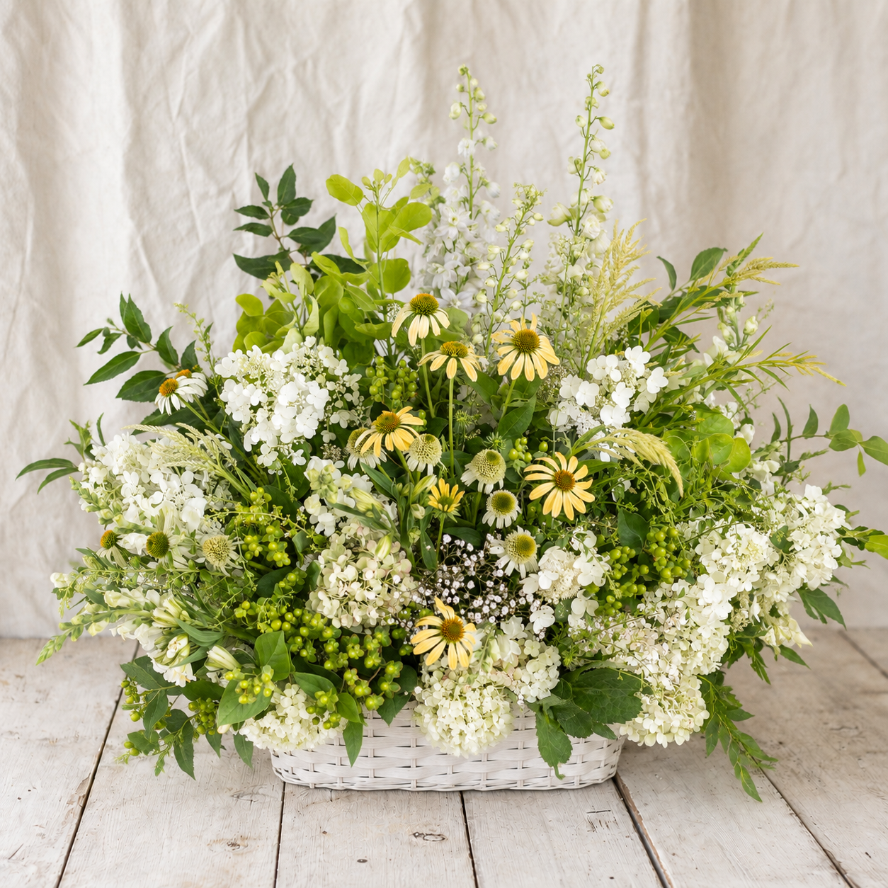 Gentle Light mid-size white green and soft yellow sympathy flower basket by Rooted Flowers