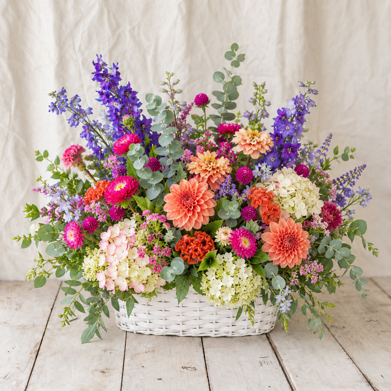 Lasting Love mid-size jewel-tone sympathy flower basket with coral magenta and violet flowers by Rooted Flowers
